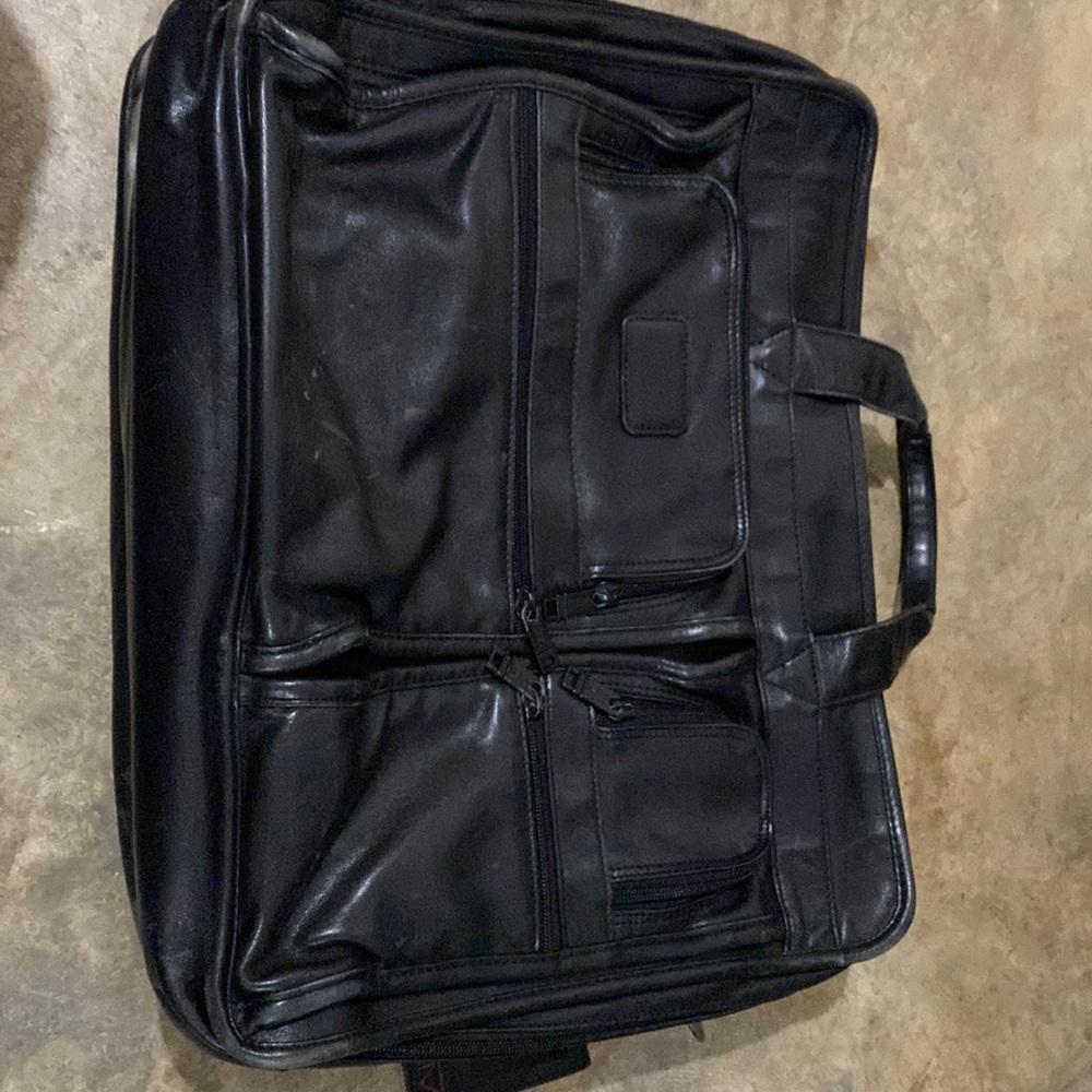 Authentic TUMI briefcase. 3 large compartments.
